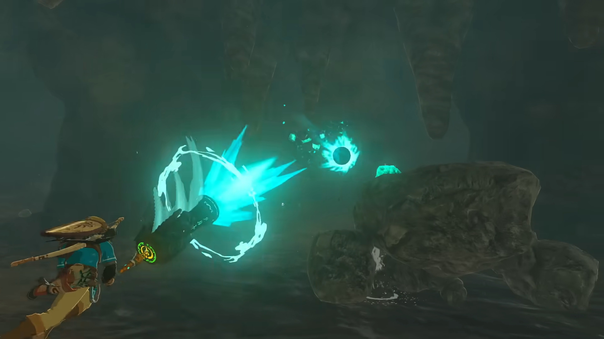 Link shooting what looks like a Sheikah cannonball over a talos in a cave