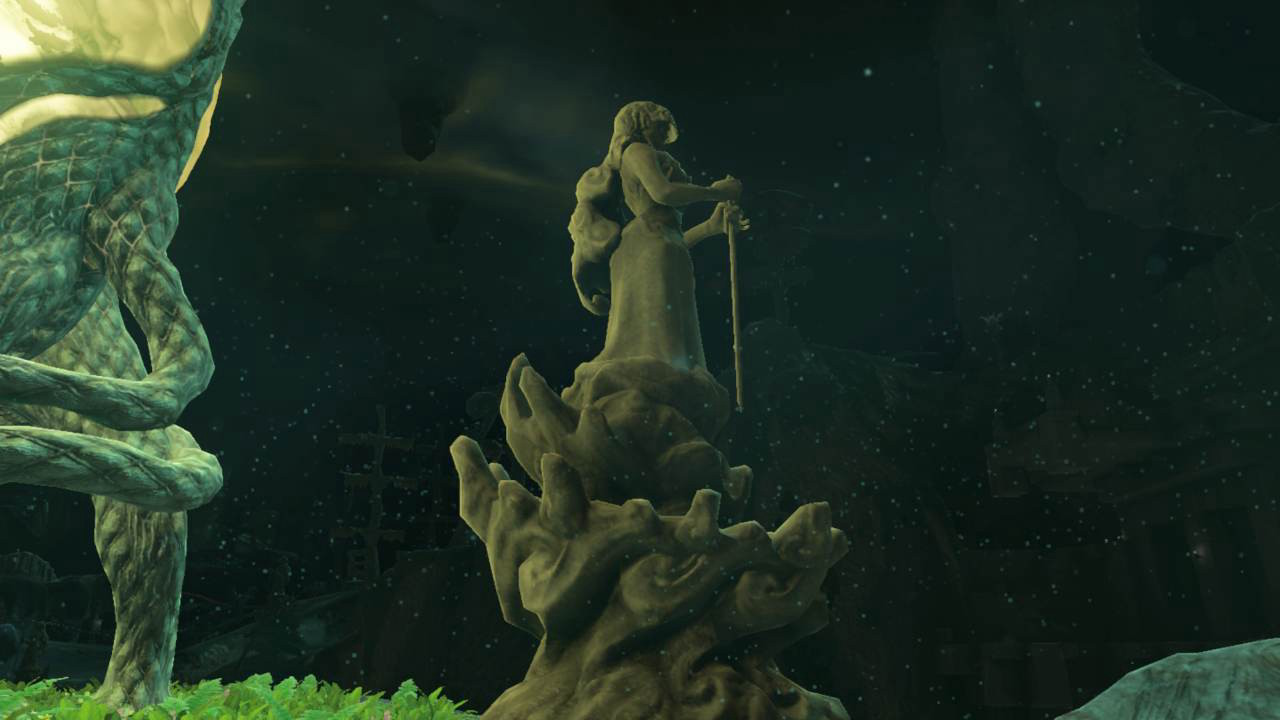 Statue in the depths. The figure is feminine and holds a sword