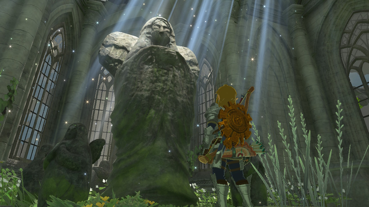 Link stands before goddess statue inside the temple