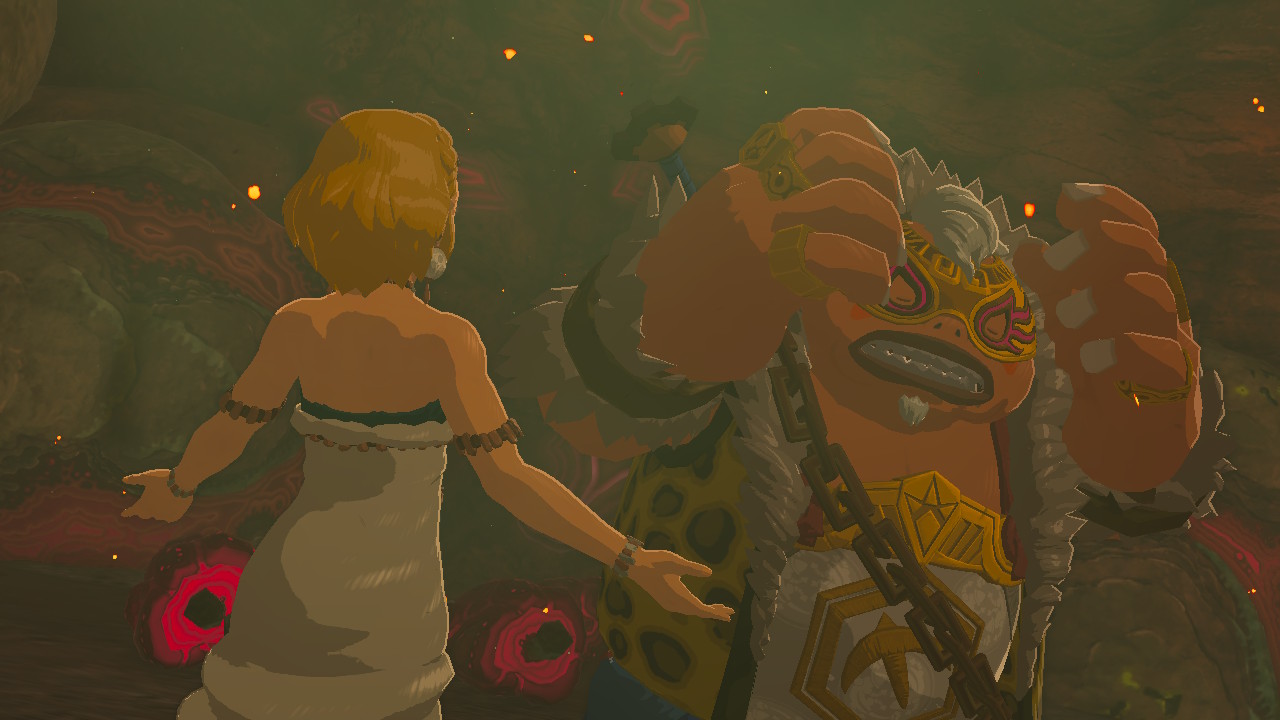 Yunobo covers his head with his hands, agitated, as the Zelda figure speaks to him, arms spread imploringly, as if she is trying to convince him of something