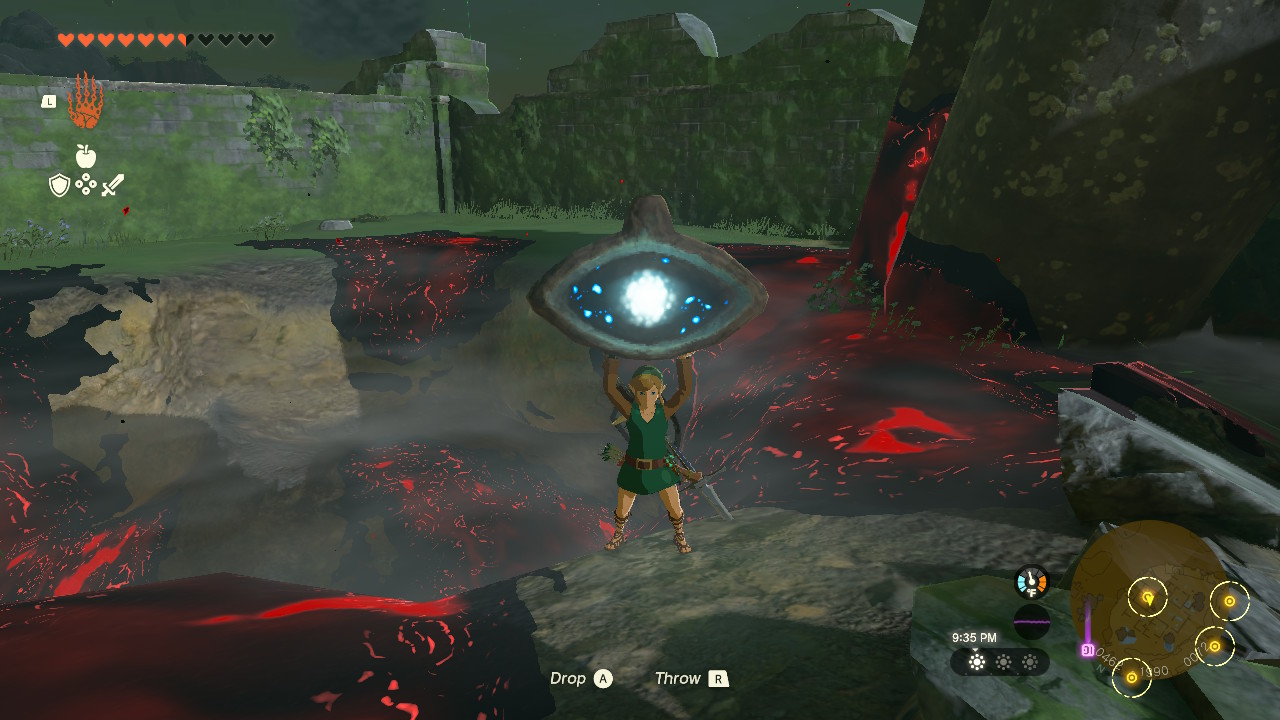 Link holding up a stone eye