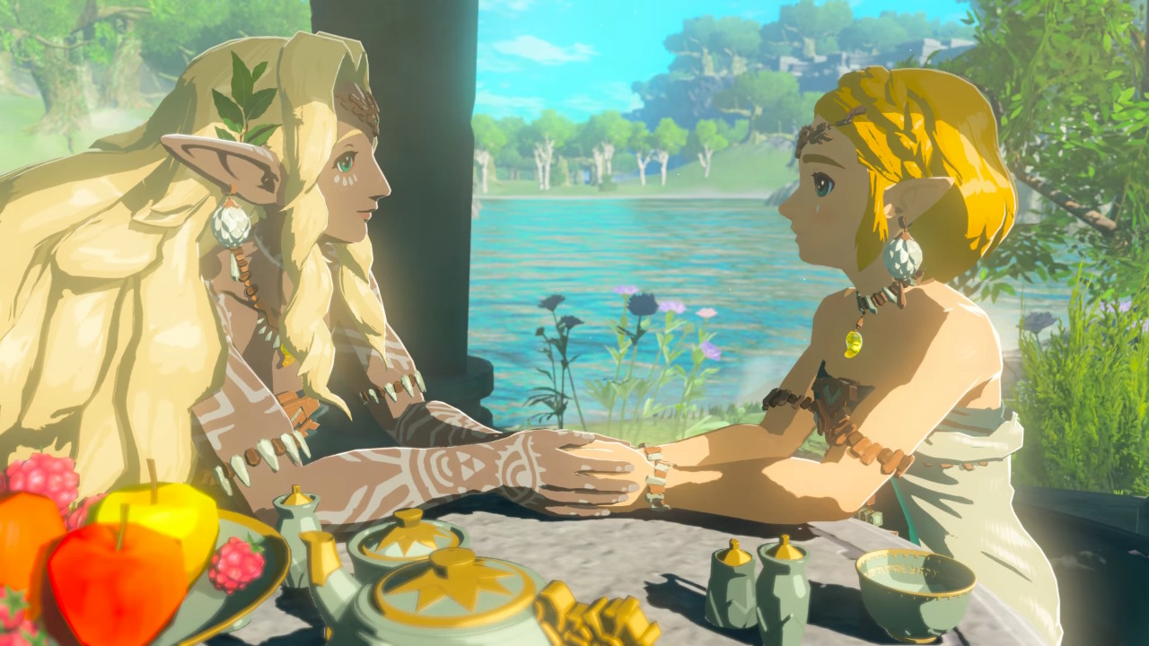 Sonia gazes with care at Zelda, still holding her hands